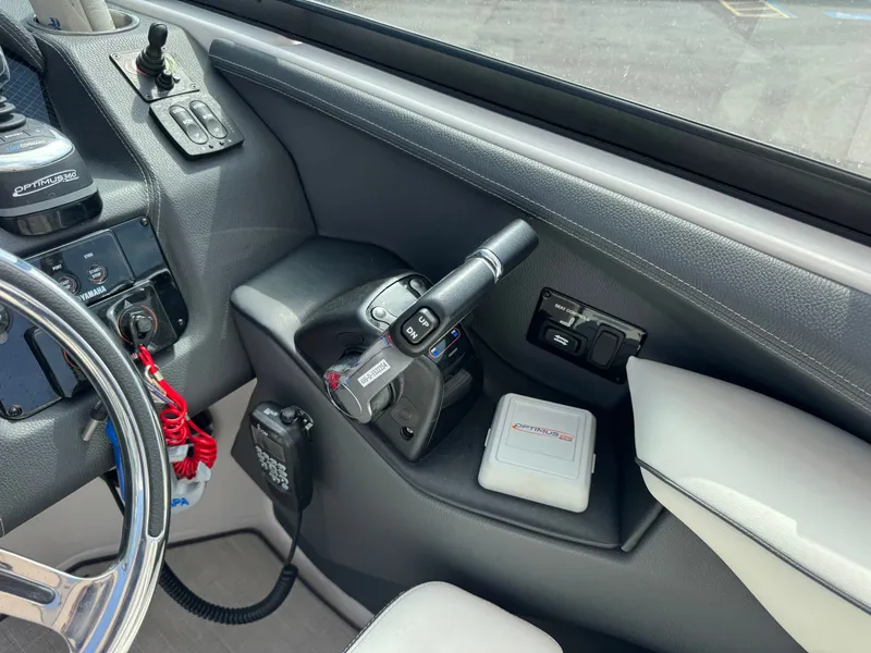 Slide: The Image of Interior view of a 2021 Regal 29 OBX boat helm. - 16