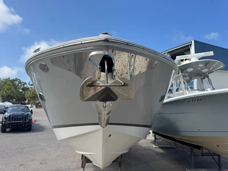 Slide: The Image of Regal 29 OBX 2021 boat with anchor, side view. - 2