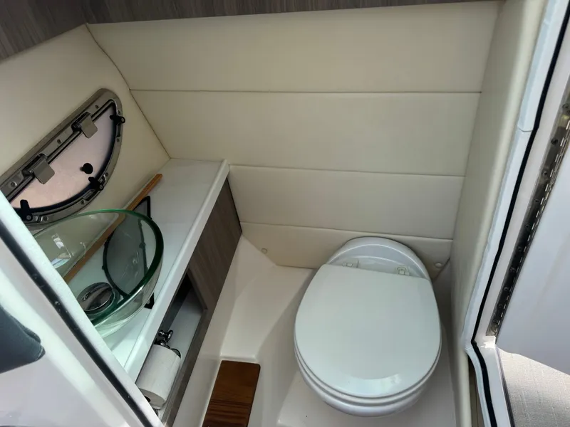 Slide: The Image of Interior of 2021 Regal 29 OBX featuring toilet and sink. - 20