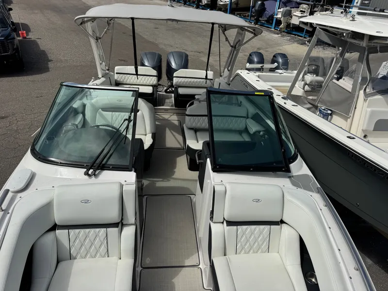 Slide: The Image of Interior view of a 2021 Regal 29 OBX boat with luxurious seating. - 23