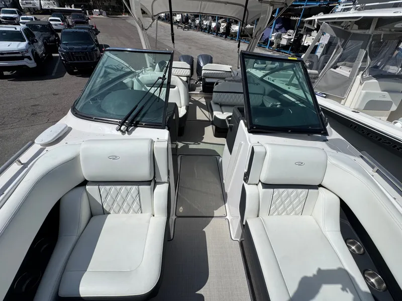 Slide: The Image of Interior view of a 2021 Regal 29 OBX boat with white seating. - 26