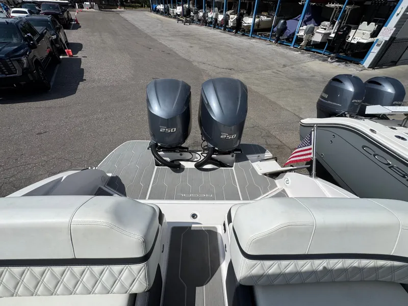Slide: The Image of 2021 Regal 29 OBX with twin outboard engines at the dock. - 5