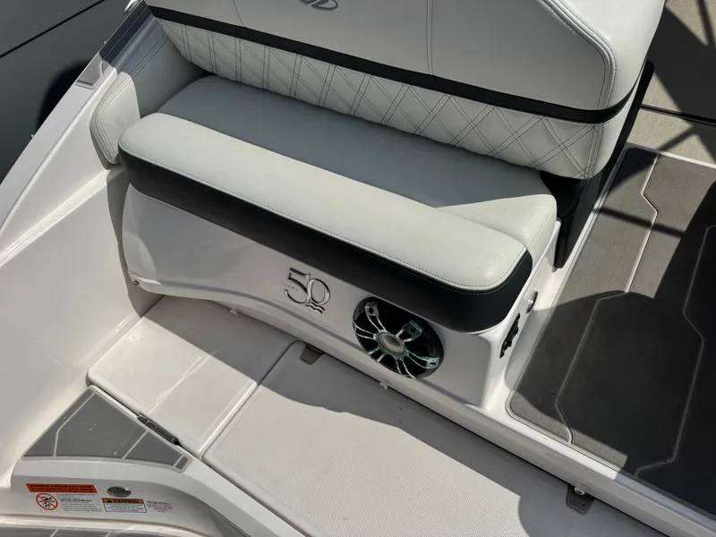Slide: The Image of Regal 29 OBX 2021 boat seat with speaker and 50th anniversary logo. - 7