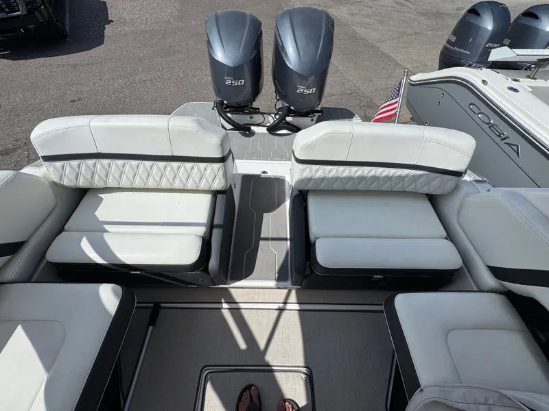 Slide: The Image of Interior of a 2021 Regal 29 OBX boat with twin outboard engines. - 8