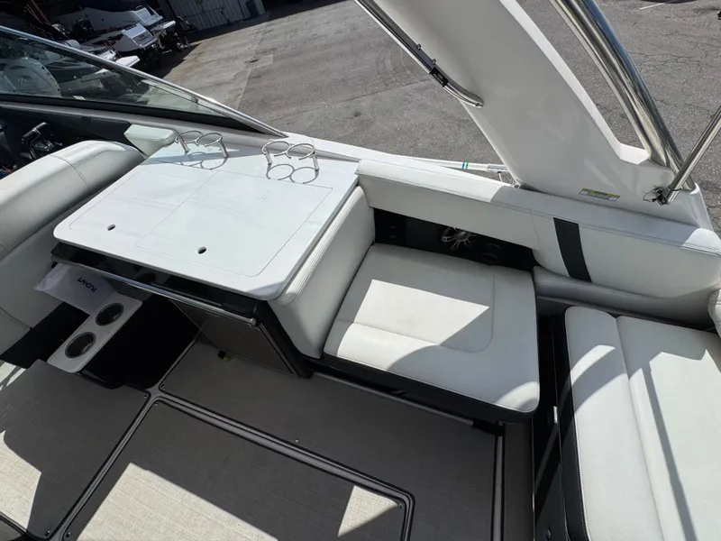 Slide: The Image of Interior of a 2021 Regal 29 OBX boat with seating area and table. - 9