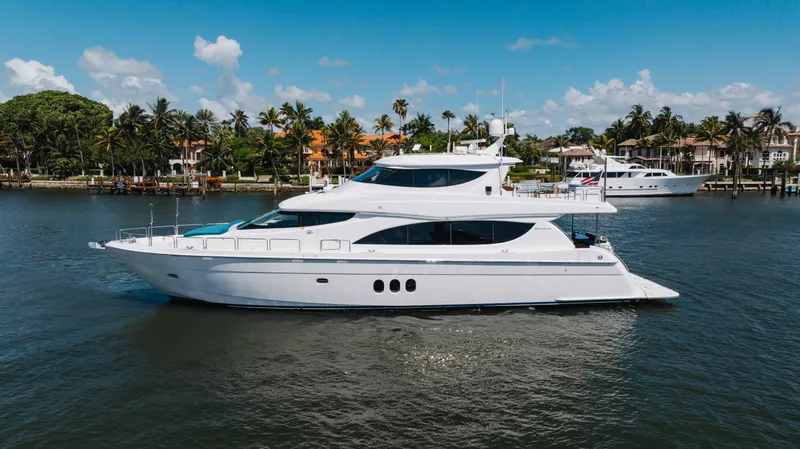 The Image of 2014 Hatteras 80 Motor Yacht Sky Lounge cruising on a sunny day. - 0