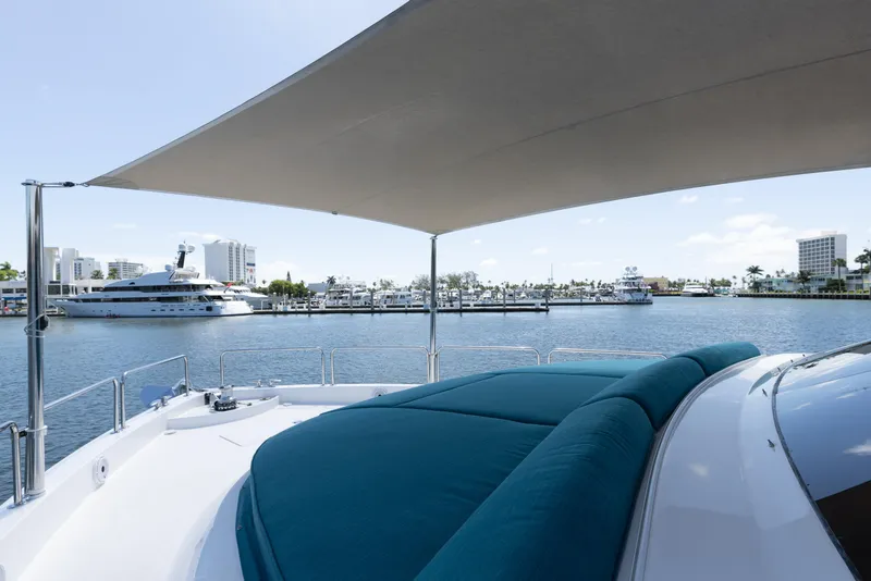 Slide: The Image of Hatteras 80 Motor Yacht Sky Lounge 2014, featuring spacious deck and waterfront view. - 13