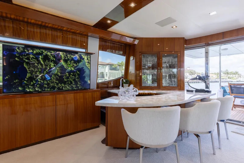 Slide: The Image of Luxurious interior of 2014 Hatteras 80 Motor Yacht Sky Lounge with elegant dining area. - 17