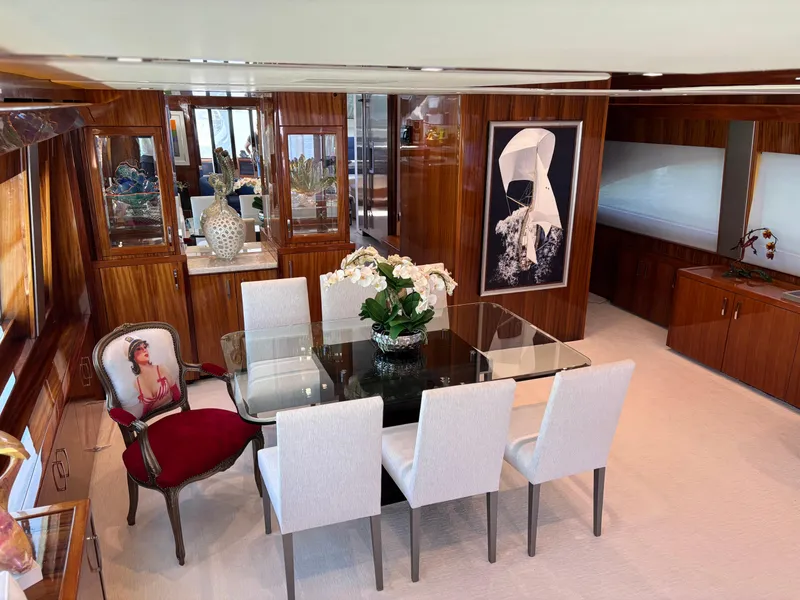 Slide: The Image of Luxurious dining area in 2014 Hatteras 80 Motor Yacht Sky Lounge with elegant decor. - 18