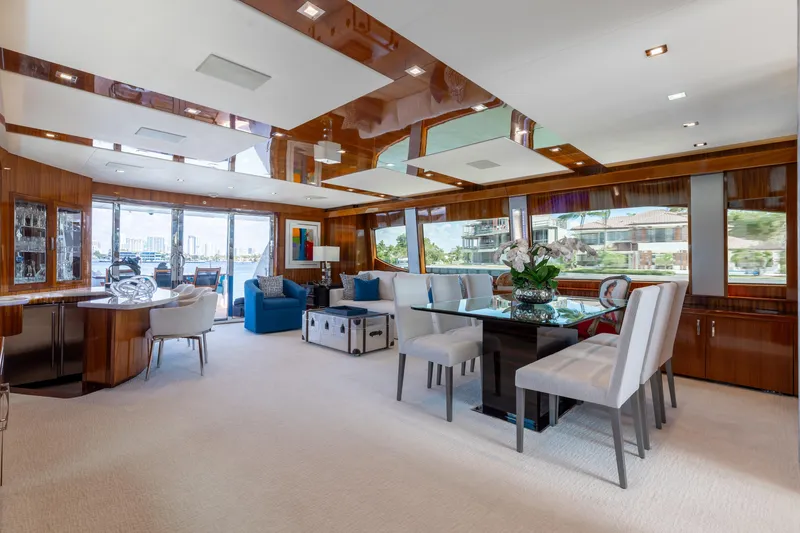 Slide: The Image of Luxurious interior of 2014 Hatteras 80 Motor Yacht Sky Lounge with elegant dining area. - 19