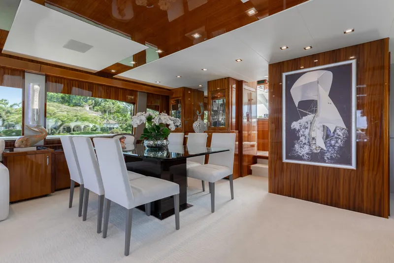 Slide: The Image of Luxurious dining area in 2014 Hatteras 80 Motor Yacht Sky Lounge with elegant decor. - 20