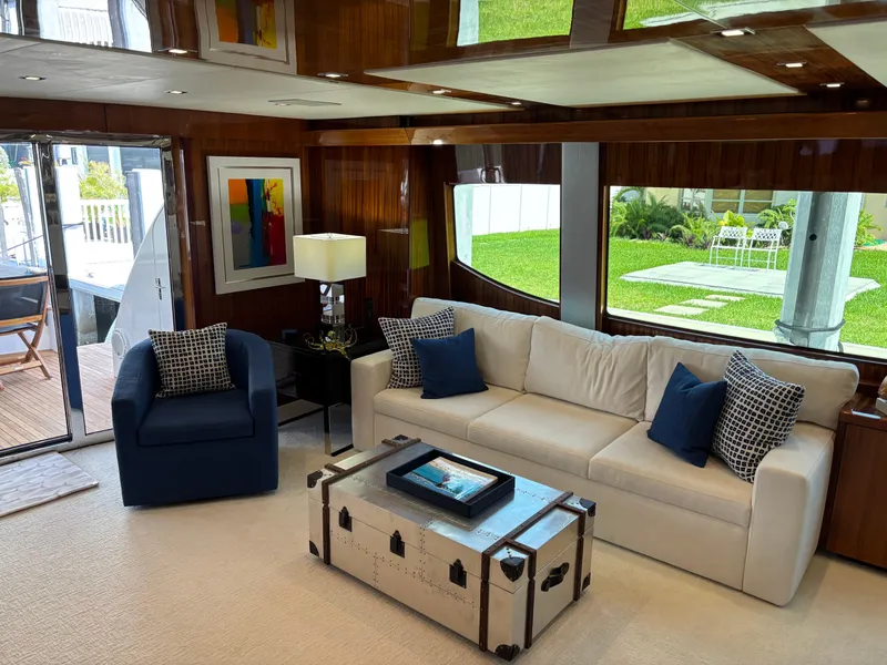 Slide: The Image of Luxurious interior of 2014 Hatteras 80 Motor Yacht Sky Lounge with elegant seating and decor. - 22