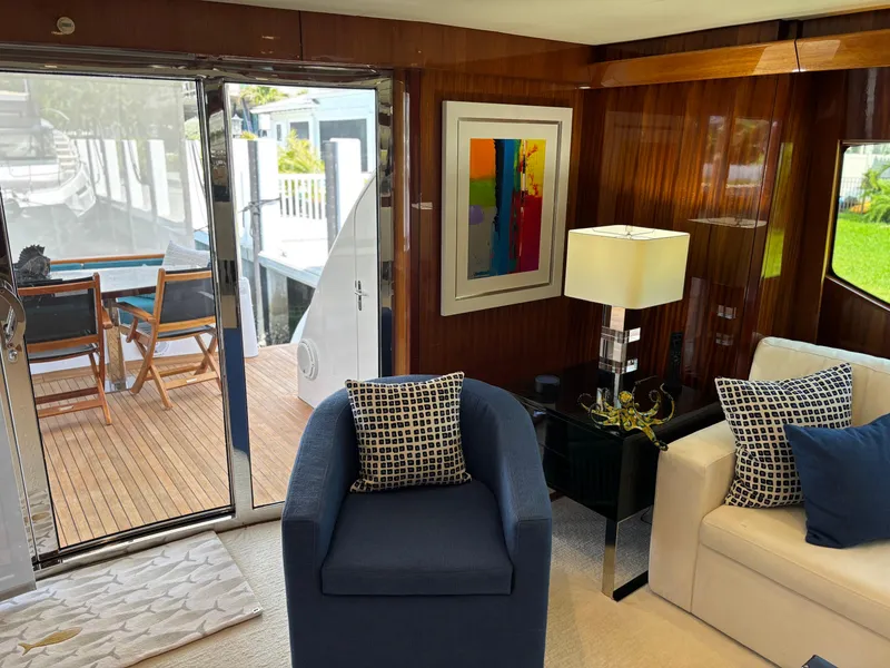 Slide: The Image of Luxurious interior of 2014 Hatteras 80 Motor Yacht Sky Lounge with elegant seating and decor. - 23