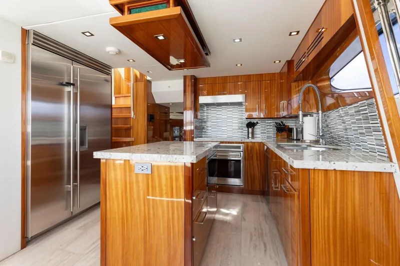 Slide: The Image of Luxurious kitchen interior of 2014 Hatteras 80 Motor Yacht Sky Lounge with modern appliances. - 25