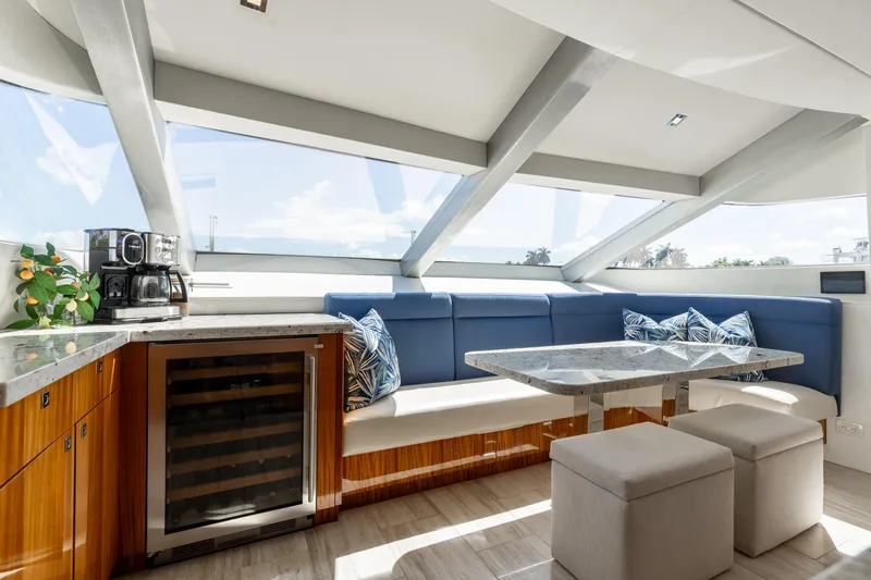 Slide: The Image of Luxurious interior of 2014 Hatteras 80 Motor Yacht Sky Lounge with modern seating and amenities. - 27