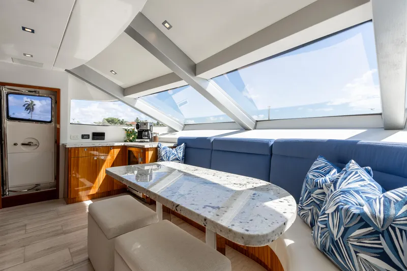 Slide: The Image of Luxurious interior of 2014 Hatteras 80 Motor Yacht Sky Lounge with panoramic windows. - 28