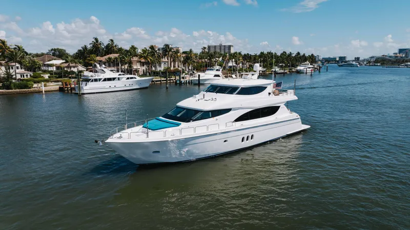 Slide: The Image of 2014 Hatteras 80 Motor Yacht Sky Lounge cruising in a scenic waterfront setting. - 3
