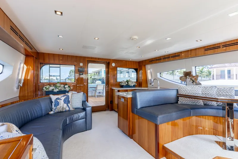 Slide: The Image of Luxurious interior of 2014 Hatteras 80 Motor Yacht Sky Lounge with elegant seating and decor. - 32