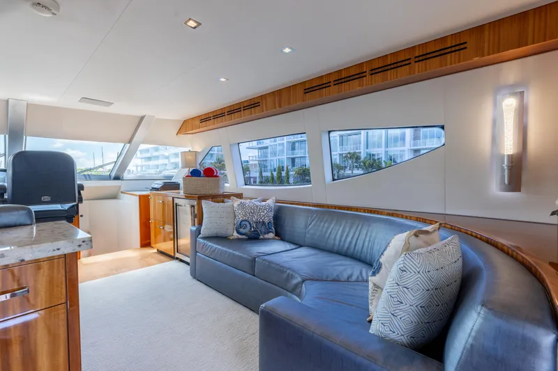 Slide: The Image of Luxurious interior of 2014 Hatteras 80 Motor Yacht Sky Lounge with elegant seating and modern decor. - 33
