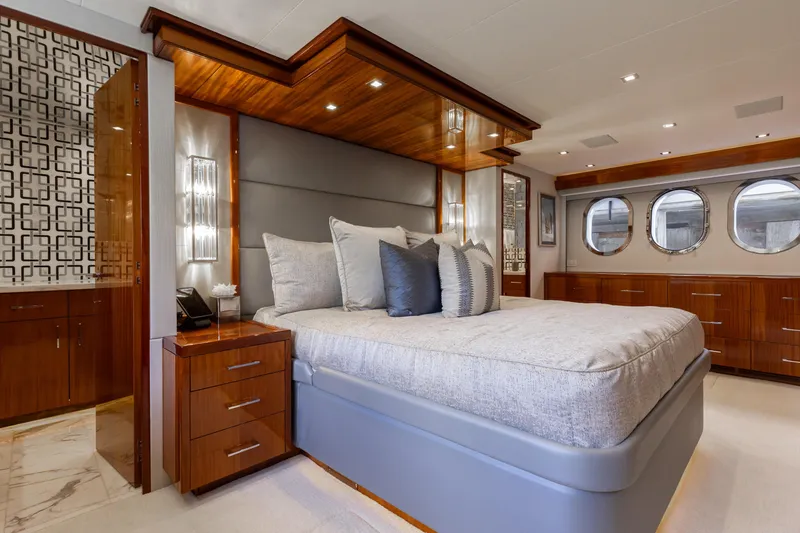 Slide: The Image of Luxurious bedroom in 2014 Hatteras 80 Motor Yacht Sky Lounge with elegant wood finishes. - 37