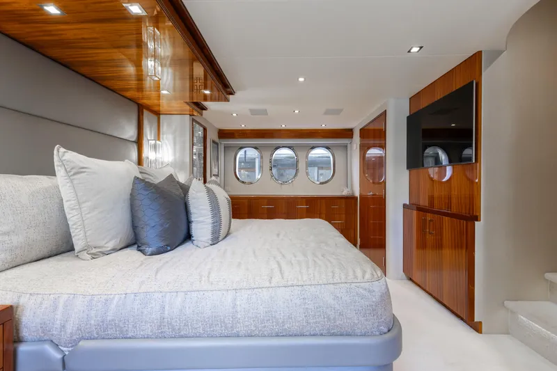 Slide: The Image of Luxurious bedroom interior of 2014 Hatteras 80 Motor Yacht Sky Lounge with elegant wood finishes. - 38
