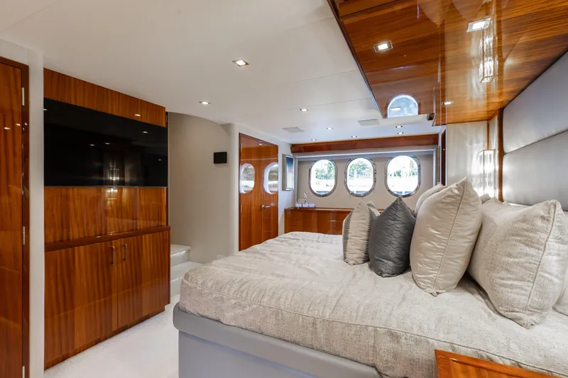 Slide: The Image of Luxurious bedroom interior of 2014 Hatteras 80 Motor Yacht Sky Lounge with elegant wood finishes. - 39