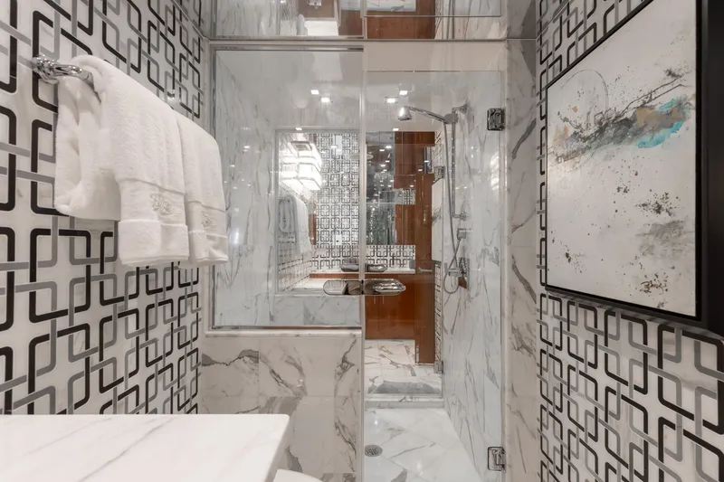 Slide: The Image of Luxurious bathroom in 2014 Hatteras 80 Motor Yacht Sky Lounge with modern design and marble accents. - 45