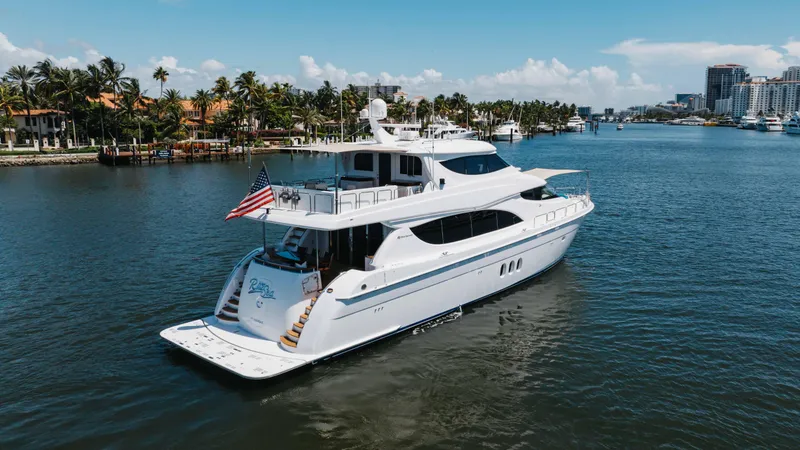 Slide: The Image of 2014 Hatteras 80 Motor Yacht Sky Lounge cruising in a scenic waterway. - 5