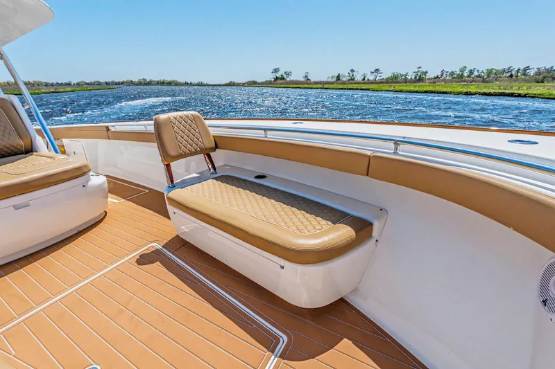 Slide: The Image of 2021 Valhalla Boatworks V-41 interior with tan seating and scenic water view. - 11