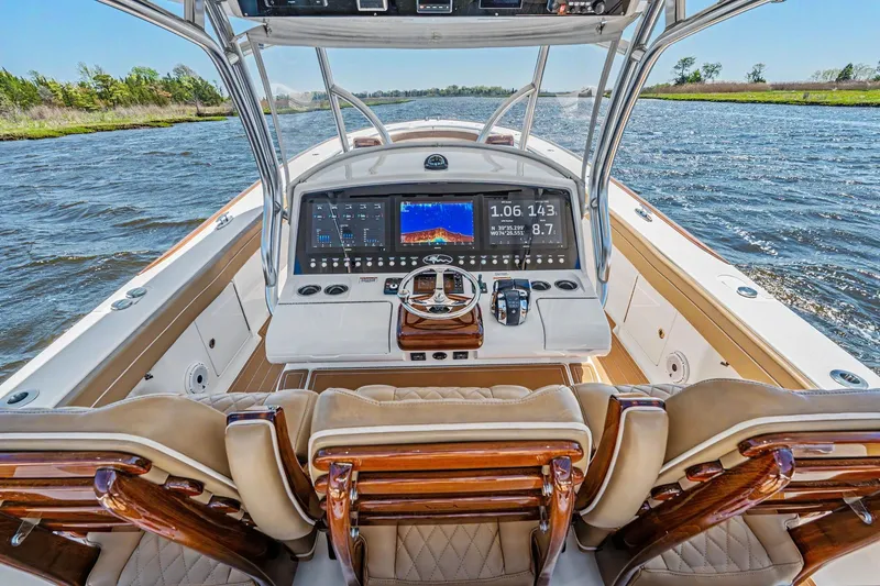 Slide: The Image of 2021 Valhalla Boatworks V-41 helm with advanced navigation system on open water. - 14