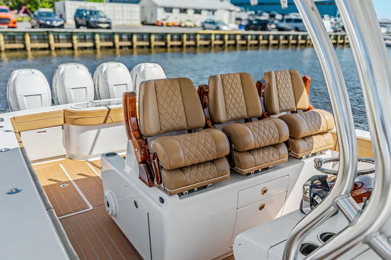 Slide: The Image of 2021 Valhalla Boatworks V-41 interior with luxurious seating and multiple outboard engines. - 20