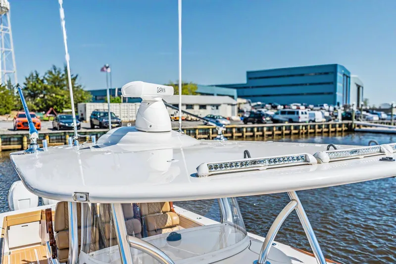 Slide: The Image of 2021 Valhalla Boatworks V-41 with radar, docked near industrial buildings. - 21
