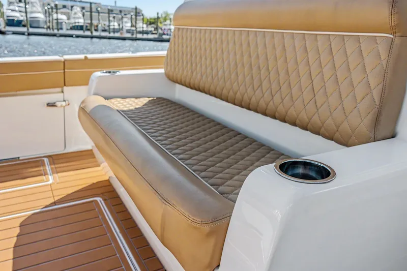 Slide: The Image of Luxurious seating on 2021 Valhalla Boatworks V-41 with diamond-stitched upholstery and cup holder. - 23