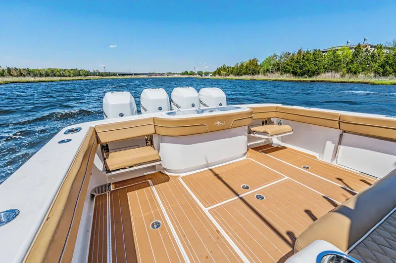 Slide: The Image of 2021 Valhalla Boatworks V-41 on water, showcasing spacious deck and powerful engines. - 24