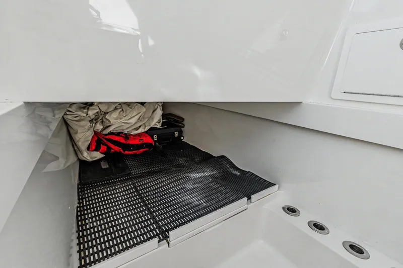 Slide: The Image of Storage compartment in 2021 Valhalla Boatworks V-41, featuring gear and equipment. - 28