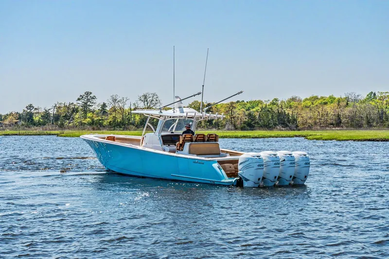 Slide: The Image of 2021 Valhalla Boatworks V-41 cruising on a scenic lake with four engines. - 3