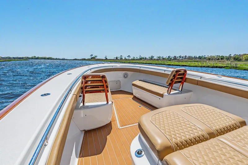 Slide: The Image of 2021 Valhalla Boatworks V-41 interior with tan seating on a sunny day. - 6