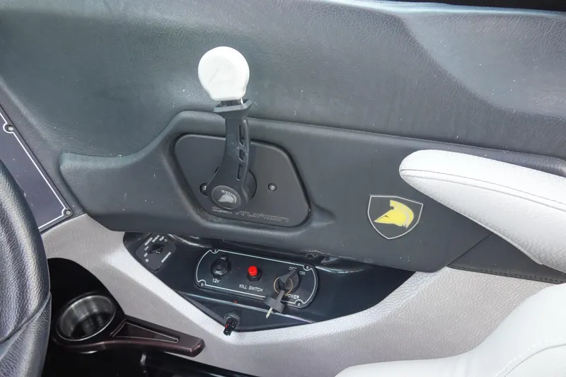 Slide: The Image of Interior of 2016 Centurion Enzo FS33 boat with control panel and logo. - 14