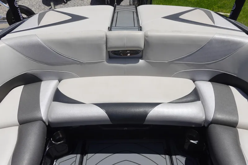 Slide: The Image of 2016 Centurion Enzo FS33 boat interior with sleek, modern seating design. - 17