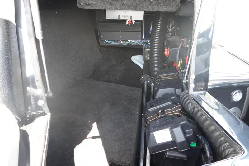 Slide: The Image of Interior view of a 2016 Centurion Enzo FS33 boat showing battery compartment and wiring. - 21