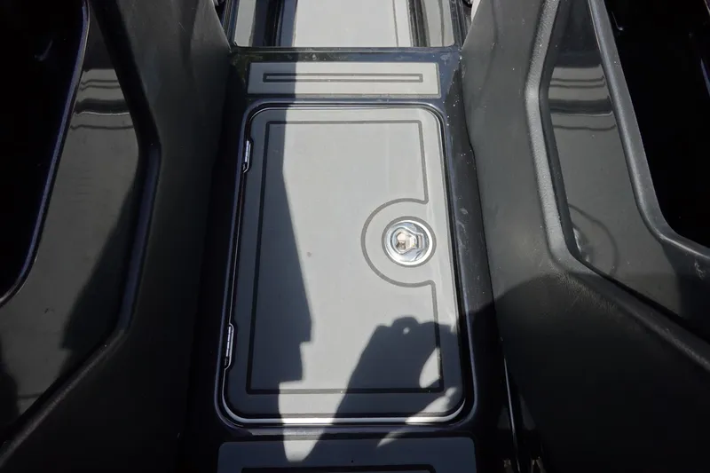 Slide: The Image of 2016 Centurion Enzo FS33 boat storage compartment with secure latch. - 23