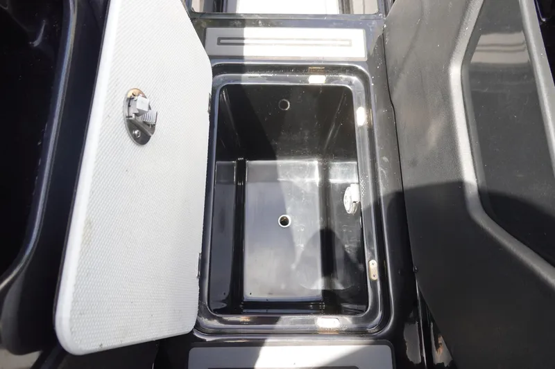 Slide: The Image of Open storage compartment in 2016 Centurion Enzo FS33 boat. - 24