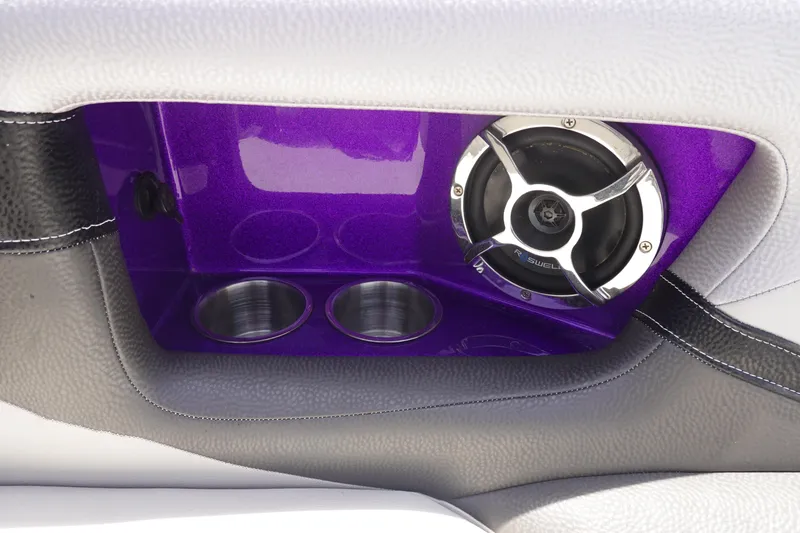 Slide: The Image of 2016 Centurion Enzo FS33 interior with purple speaker and cup holders. - 29