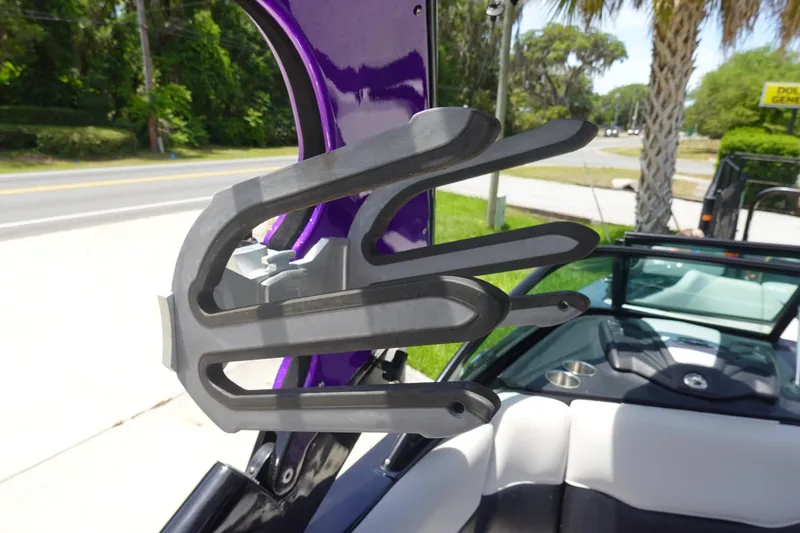 Slide: The Image of 2016 Centurion Enzo FS33 wakeboard rack with purple accents, parked near a road. - 30