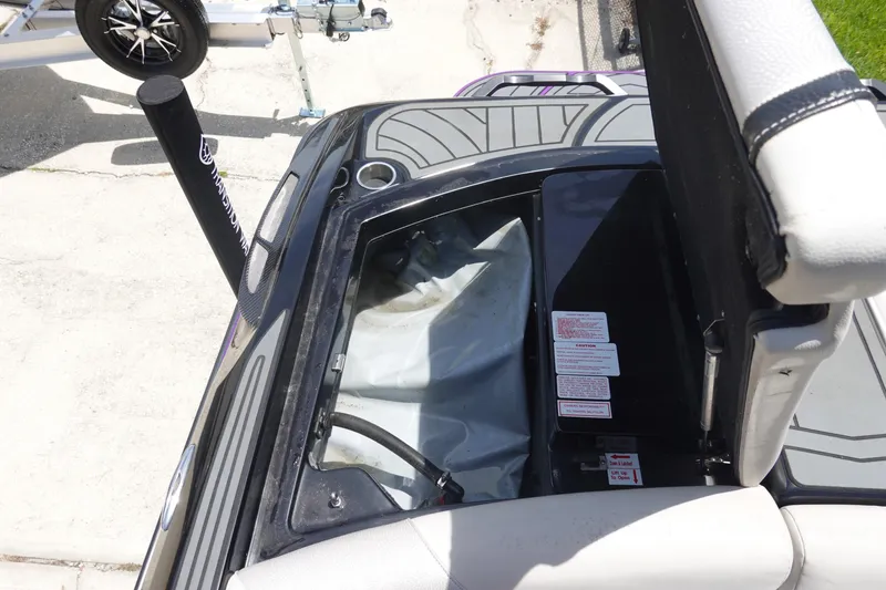 Slide: The Image of 2016 Centurion Enzo FS33 boat interior storage compartment with open hatch. - 34