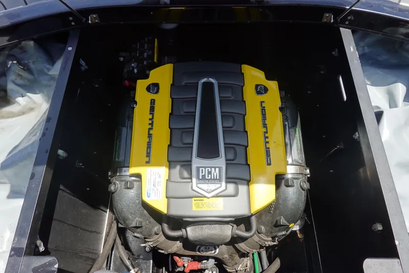 Slide: The Image of 2016 Centurion Enzo FS33 engine compartment with PCM engine, yellow and black design. - 35