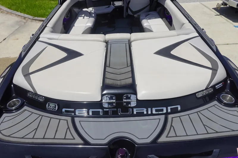 Slide: The Image of 2016 Centurion Enzo FS33 boat interior with sleek design and comfortable seating. - 6