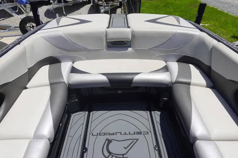 Slide: The Image of 2016 Centurion Enzo FS33 boat interior with gray and white seating. - 8