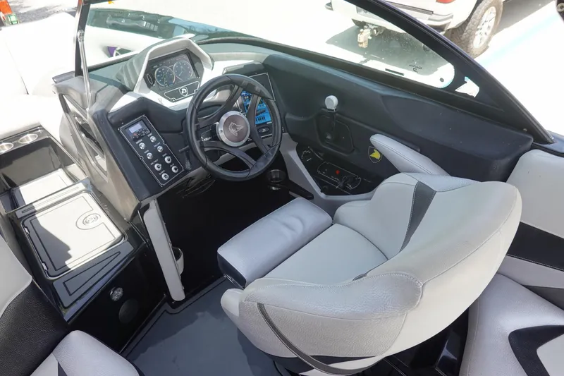 Slide: The Image of Interior of 2016 Centurion Enzo FS33 boat with steering wheel and control panel. - 9