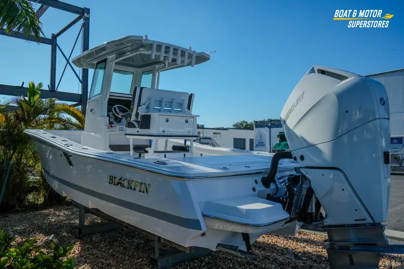 Slide: The Image of 2025 Blackfin 262 HB boat displayed outdoors with Mercury engine. - 5